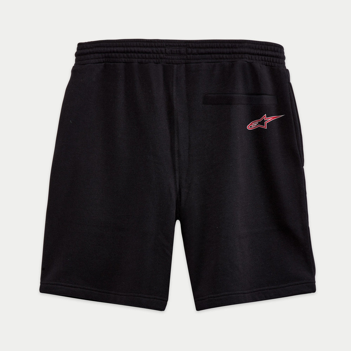 Alpinestars Dunker Short, svarta träningsshorts i fleece sett bakifrån, bakficka med passpoal, röd och vit Ageless-stjärnlogotyp på bakhöften, elastisk midja, bekväm passform