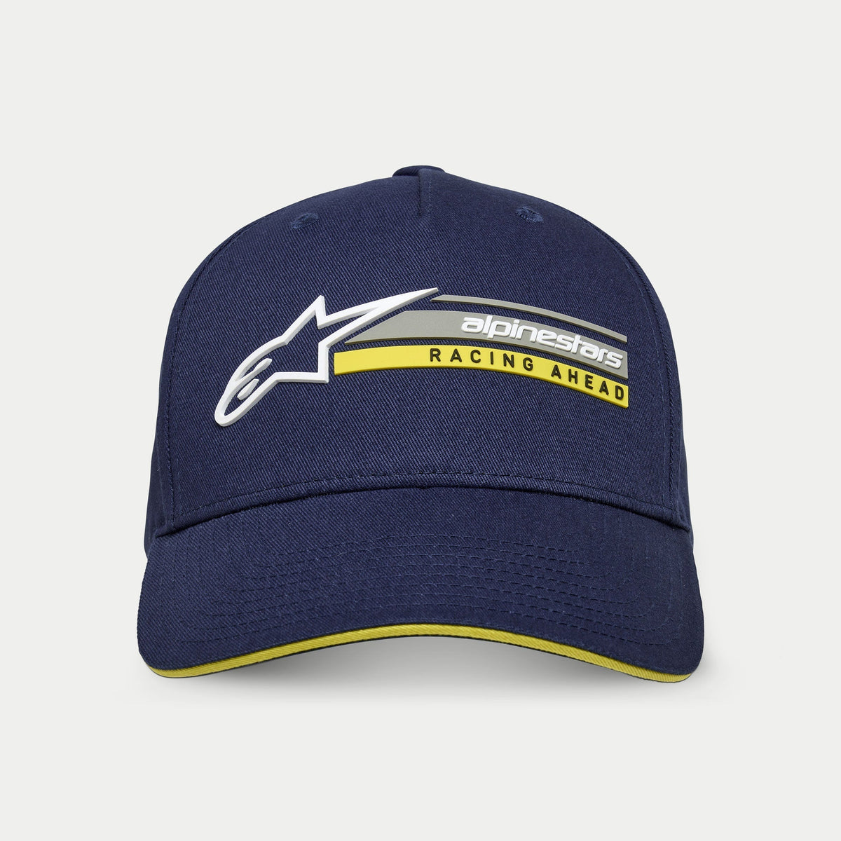 Alpinestars Par Keps, marinblå, strukturerad snapback-keps med böjd skärm, vit 3D-logotyp och 'alpinestars RACING AHEAD'-grafik i grått och gult, gul sandwich-skärm, casual motorsport-streetwear