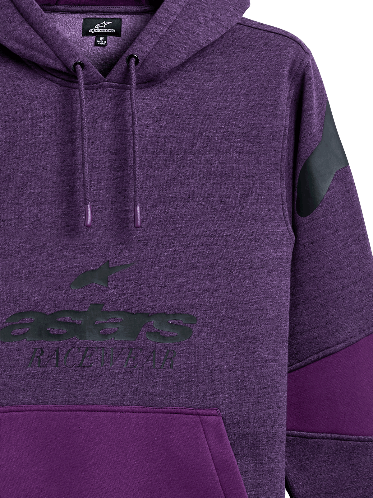 Alpinestars Perpetuate Hoodie, lila melerad huvtröja i pullovermodell, svart astars RACEWEAR-grafik på bröstet, svart logotyp på axeln, färgblocksdesign med enfärgade lila paneler, huva med dragsko och doppade ändar, avslappnad motorsportinspirerad design