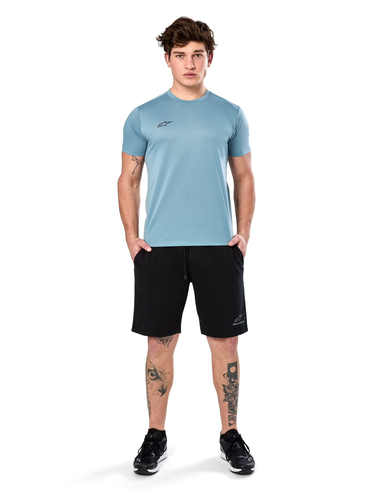 Alpinestars Point Performance Tee, Short Sleeve T-Shirt, Ice Blue, featuring a small black front logo, crew neck, worn by a model with black shorts and black sneakers, casual moisture-wicking sportswear