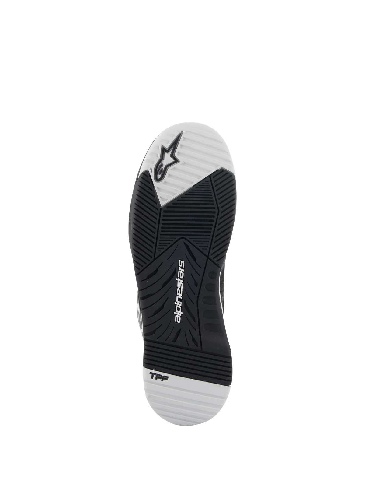 Alpinestars Speedflight-skor, svarta och vita, vy av yttersulan som visar gummisulan med dubbel densitet, Alpinestars-logotyp och TPF-märkning, asymmetriskt mönster för grepp och stabilitet vid motorcykelkörning