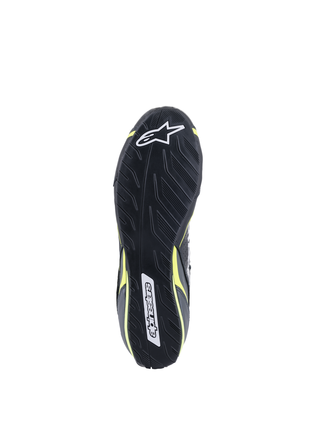 Alpinestars Tech-1 T V3-skor FIA, vy av yttersula, svart med Yellow Fluo-detaljer, asymmetrisk däckmönster-inspirerad gummisula, med Alpinestars-logotyper och texturerat mönster för pedalkänsla och grepp.
