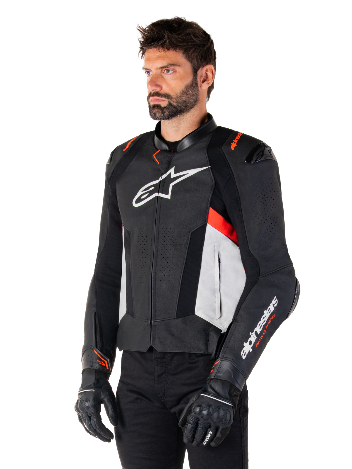 Alpinestars Missile V3 Leather Jacket, Black White and Red Fluo, racing sport motorcycle jacket worn by a model with black gloves and pants, featuring perforated leather panels and bold Alpinestars branding