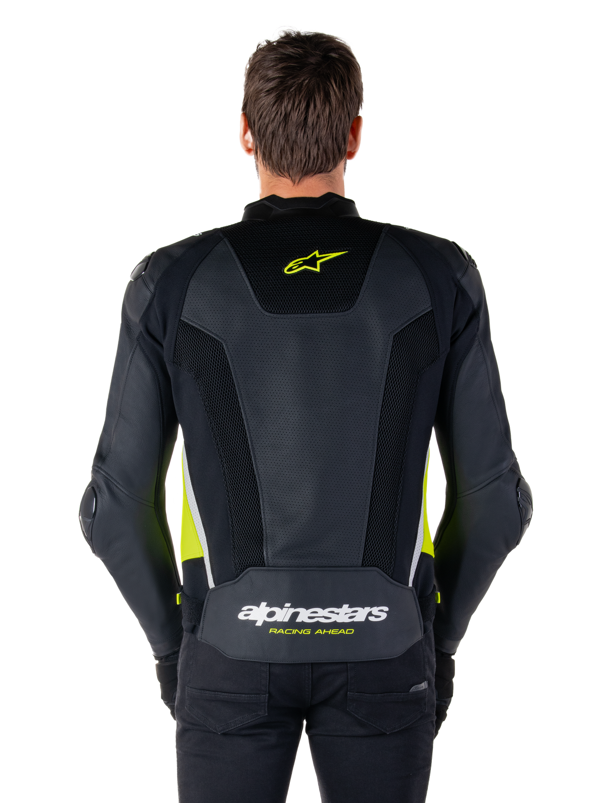 Alpinestars Missile V3 Airflow läderjacka, vy bakifrån, svart med detaljer i gul fluo och vitt, omfattande perforerade läderpaneler för kylning, Alpinestars-logotyper på övre och nedre delen av ryggen, racinginspirerad sportjacka för motorcykel