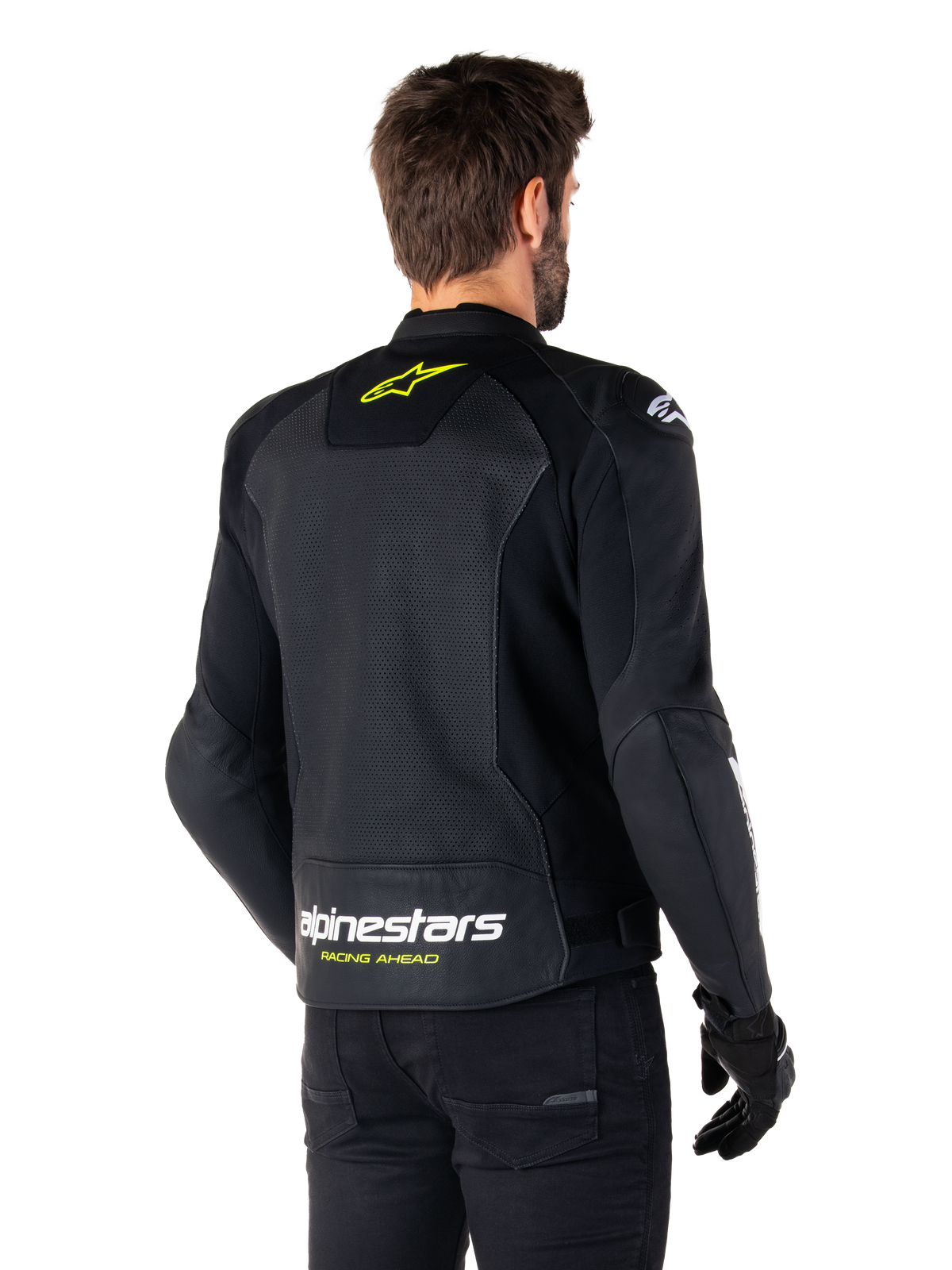 Alpinestars Faster V3 Airflow Leather Jacket, Black White and Yellow Fluo, rear view, featuring a large perforated leather back panel for ventilation, yellow star logo on the collar, and white Alpinestars branding with yellow 'Racing Ahead' text on the lower hem, sport motorcycle riding gear