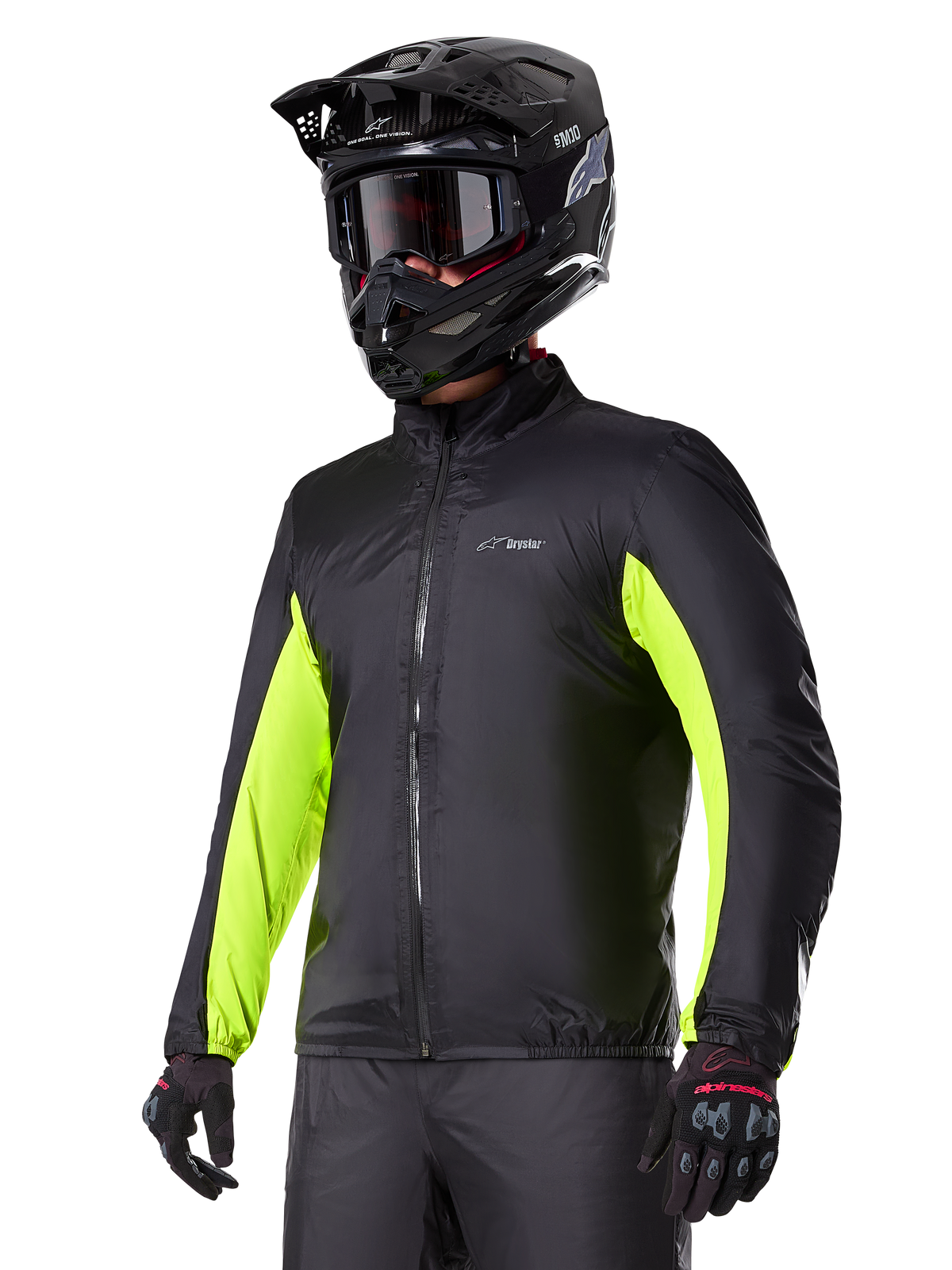 Alpinestars Bogotá Pro Drystar® vattentätt foder, svart och gul fluo, adventure-touring-foder buret av en förare med hjälm.