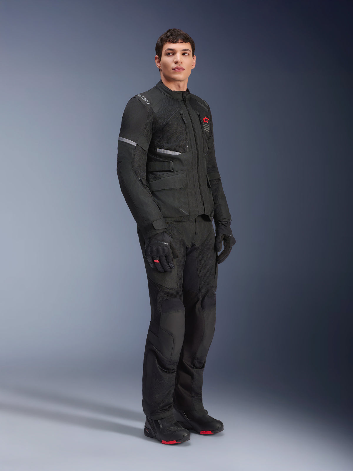 Alpinestars Andes Air Drystar® Jacket and Pants, Adventure Touring Outfit, Black, full-body view of model wearing coordinated motorcycle gear including gloves and boots, featuring breathable mesh panels and red branding accents.