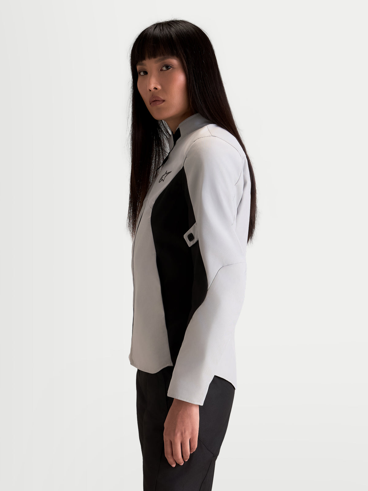 Alpinestars Stella C-1 Waterproof Jacket, women's urban motorcycle jacket in ice gray and black, side profile view worn by a model showcasing the textile construction and ergonomic collar