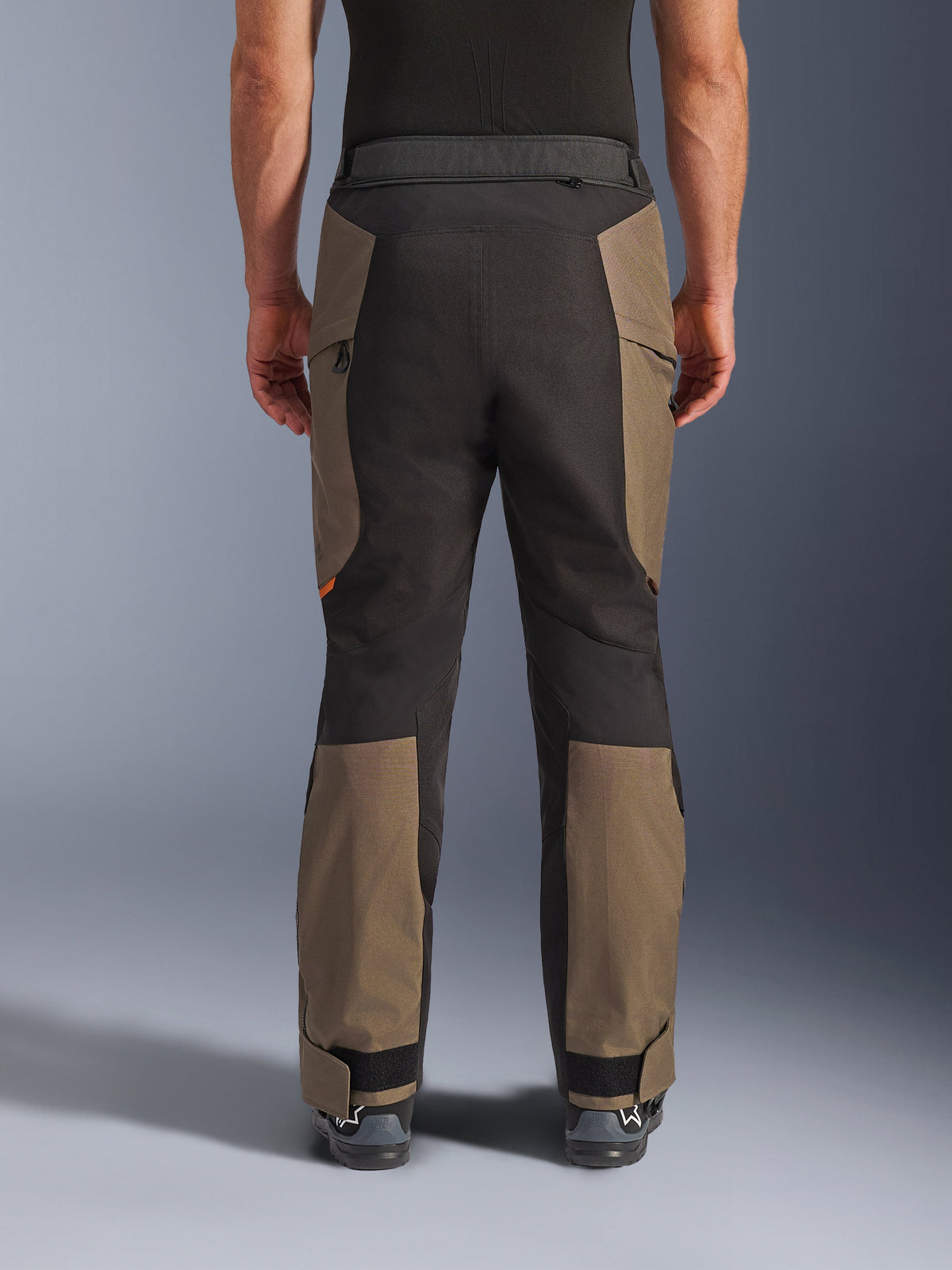 Alpinestars Cusco Drystar® Pants, Adventure Motorcycle Pants, Walnut Black, rear view on model, durable textile construction with color-blocked panels, adjustable hem, and zippered waist detail for touring and adventure riding