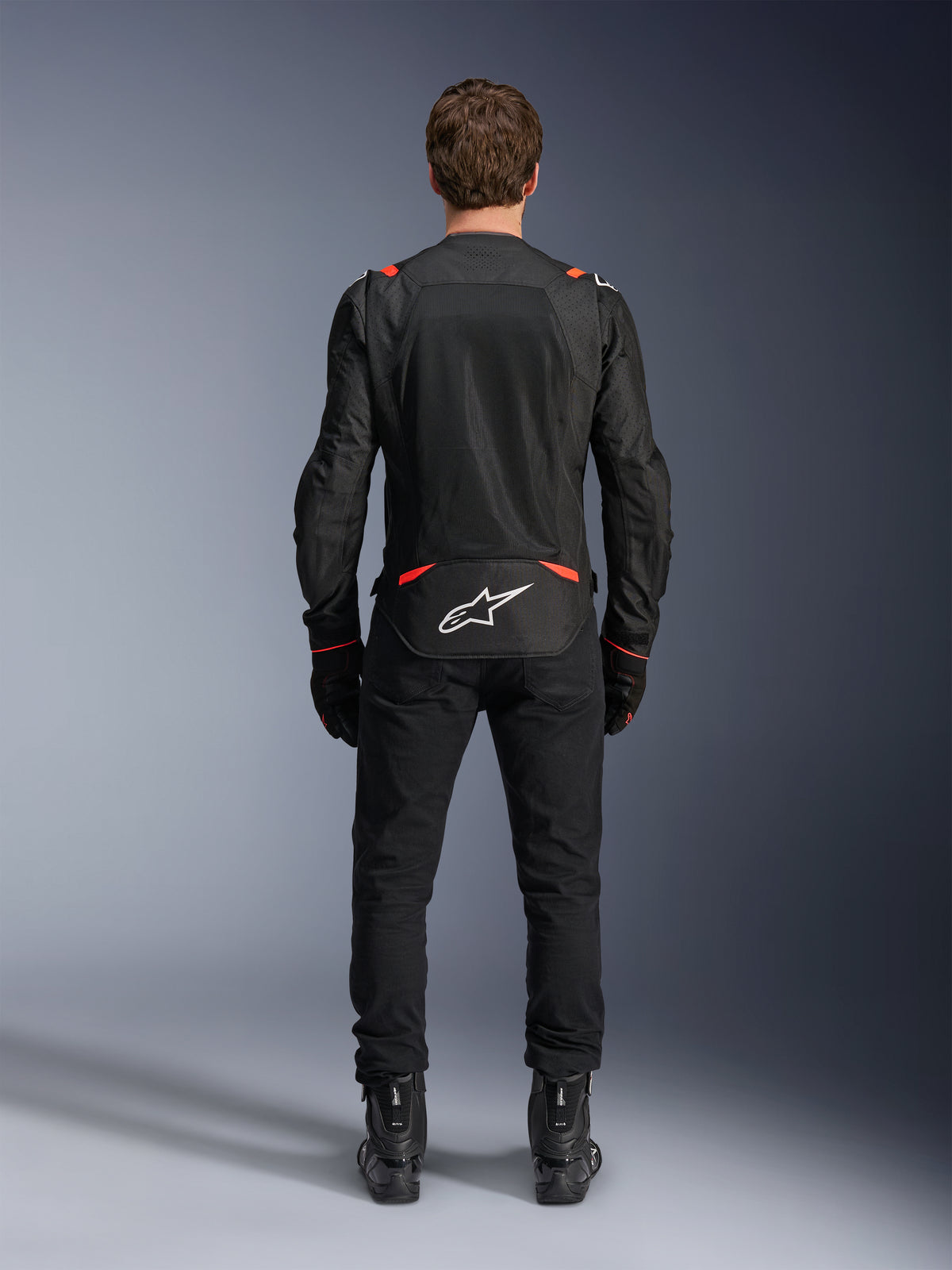 Alpinestars T-SPS Air V2 jacka, herr-motorcykeljacka, svart och röd fluo, vy bakifrån med meshpaneler i textil.