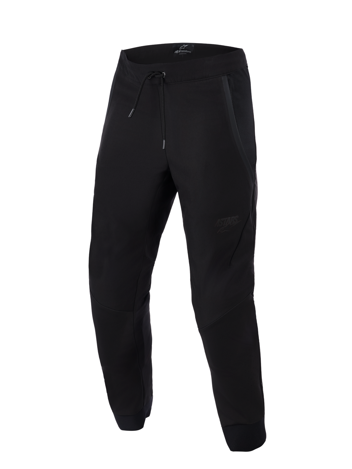Alpinestars Aeroshell Airflow byxor, svarta, lätta motorcykelbyxor för sport och touring, med omfattande meshpaneler för ventilation, elastisk midja med dragsko, förböjda ben och diskret ton-i-ton-logotyp på låret