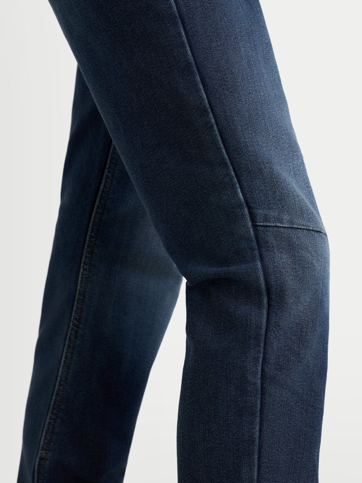 Alpinestars Stella Flex-AST 5 Denim Pants, women's urban motorcycle riding jeans, indigo washed, close-up view showing single-layer stretch denim construction and adaptive knee coverage
