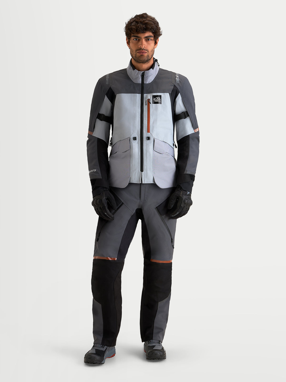Alpinestars St-7 V2 2L Gore-Tex® Gear Set, men's adventure touring motorcycle jacket and pants in mid gray, light gray, and black, front view on a model wearing matching waterproof riding apparel.