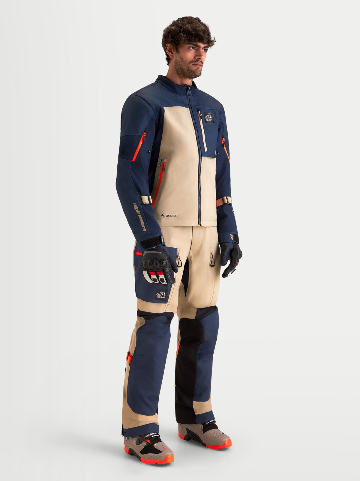Alpinestars Arenis Gore-Tex Gear Set, men's adventure touring motorcycle jacket and pants in night navy and aluminum, full-body studio view on a model wearing matching protective gear and boots