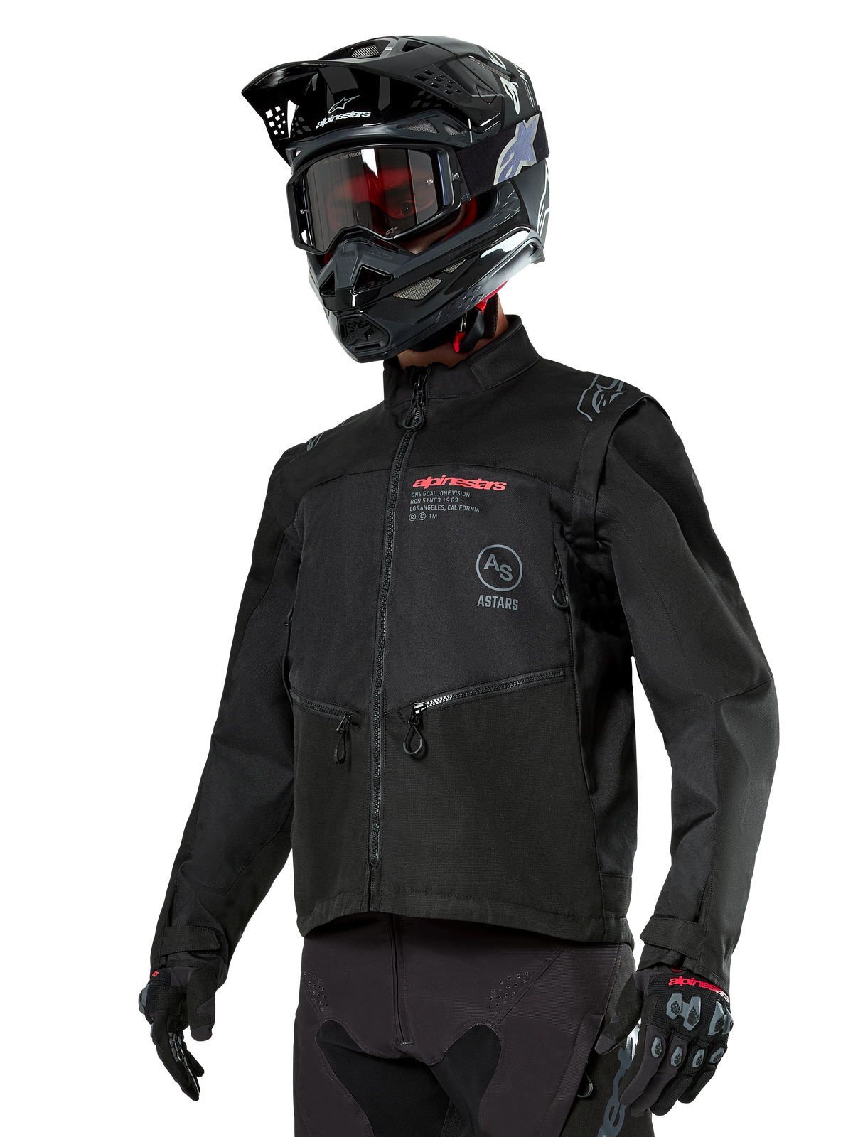 Alpinestars Pro-Dura Jacket, offroad-motorcykeljacka, svart med röda och grå logotyper, framfickor med dragkedja och hög krage, bärs med en svart motocrosshjälm och handskar för endurokörning