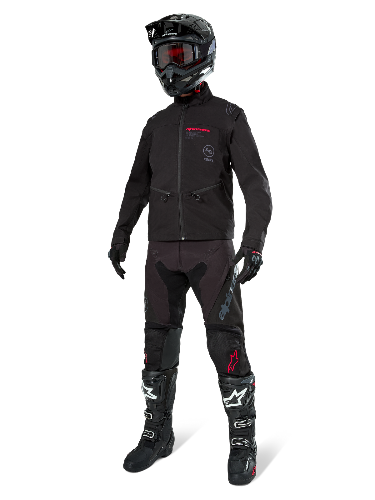 Alpinestars Lite-Dura Softshell-jacka, svart, buren av en skyltdocka som en del av ett komplett set offroad-utrustning med svarta byxor, svartvita stövlar, svart hjälm med röda goggles, professionella motocross- och endurokläder