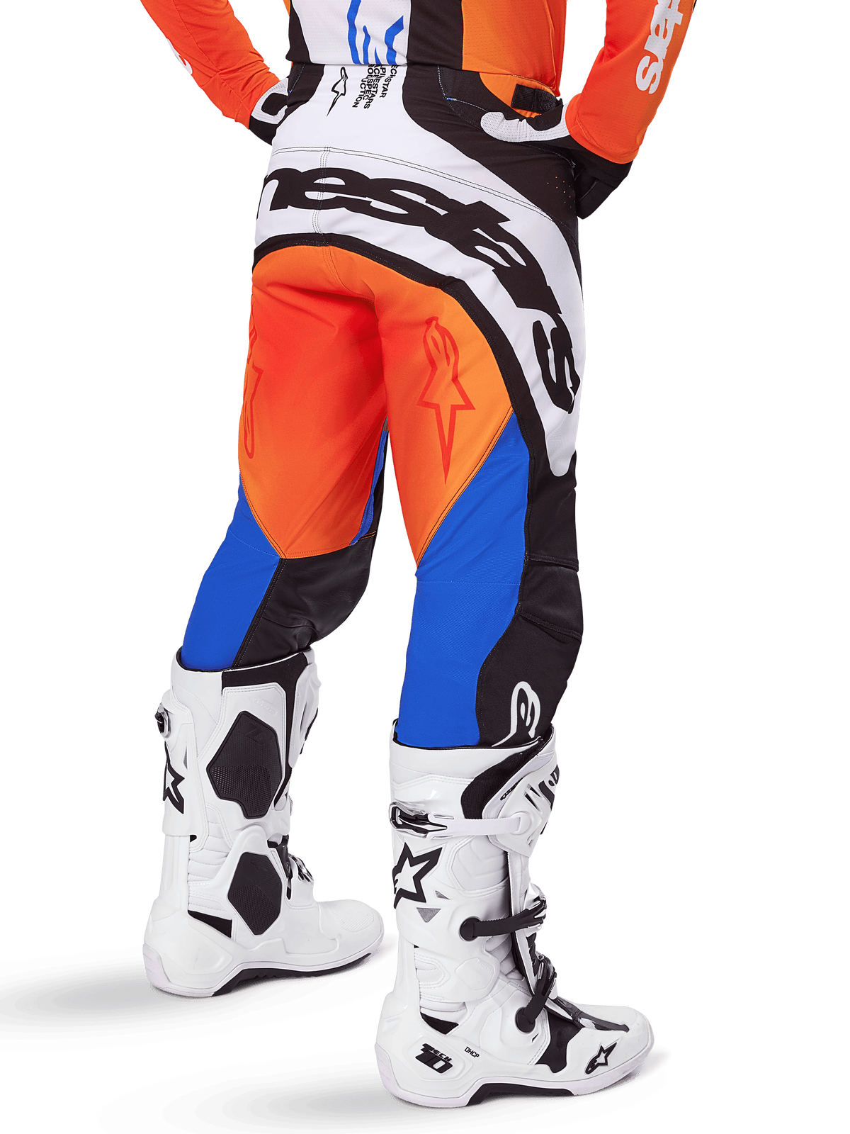 Alpinestars 2025 Techstar Melt Pants, Motocross Pants, Orange and Blue, viewed from behind, featuring large white branding on the seat, worn with matching orange jersey and white Tech 10 boots, durable off-road racing gear