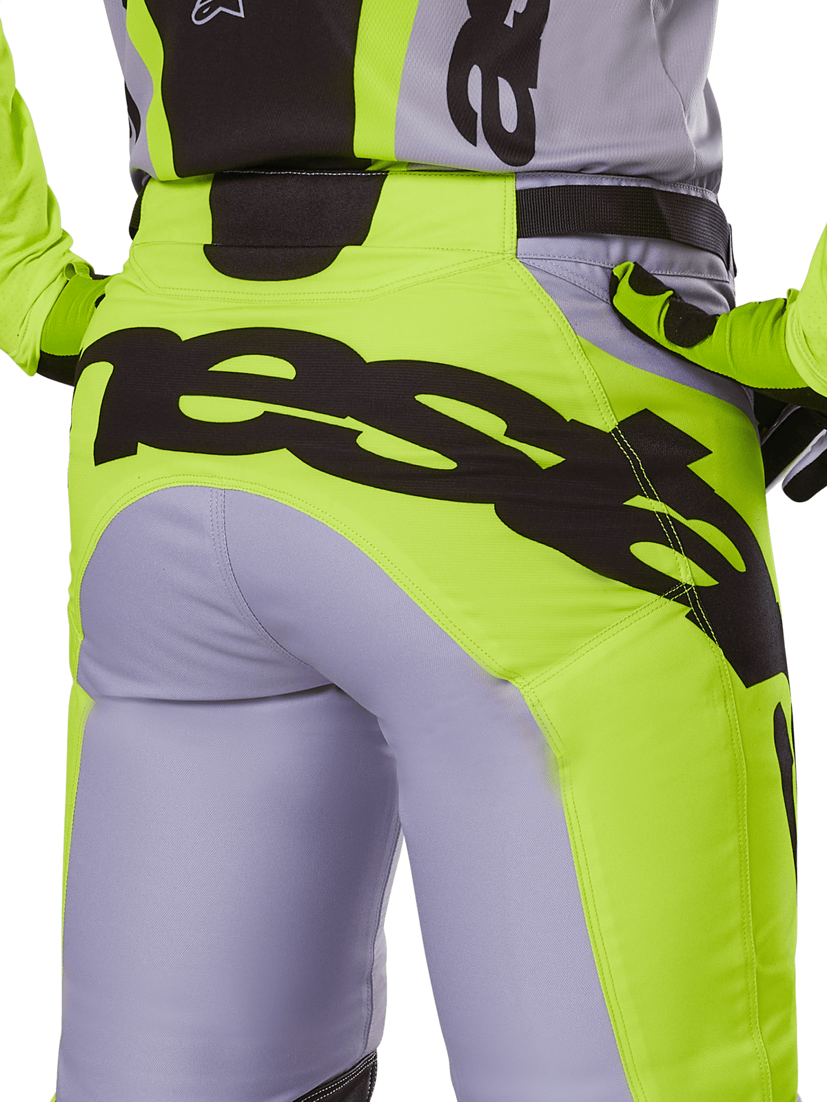 Alpinestars 2025 Racer Veil-byxor, motocrossbyxor, grå och gul fluo, vy bakifrån med stor svart logotyp över sätet, bärs med matchande tröja och handskar, teknisk offroad-design