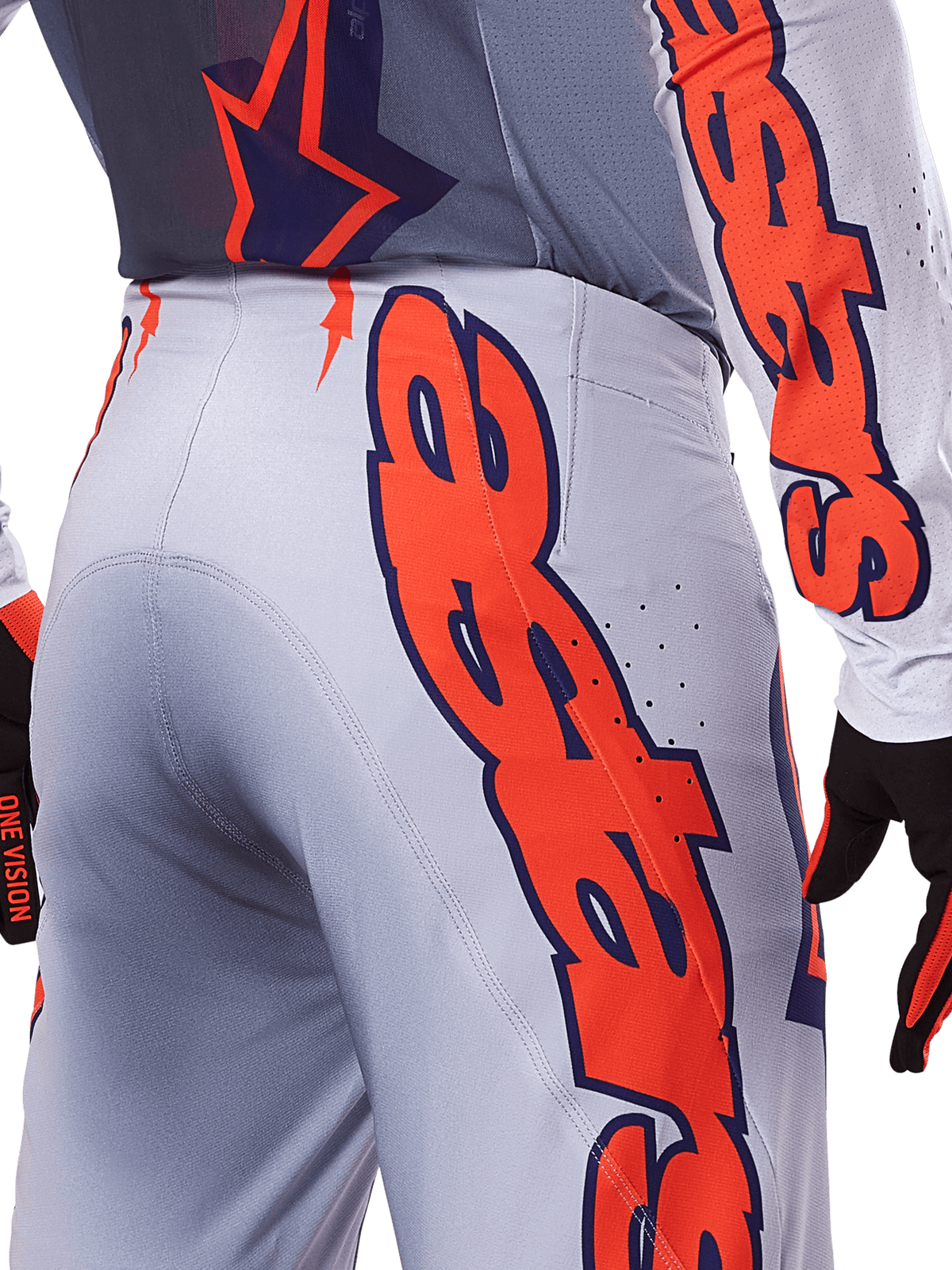 Alpinestars 2025 Supertech Lipan byxor och tröja, motocross-utrustningsset, grå och orange fluo, närbild på sidan och baksidan som visar stor orange Alpinestars-grafik, högpresterande ripstop-tyg med perforerad ventilation