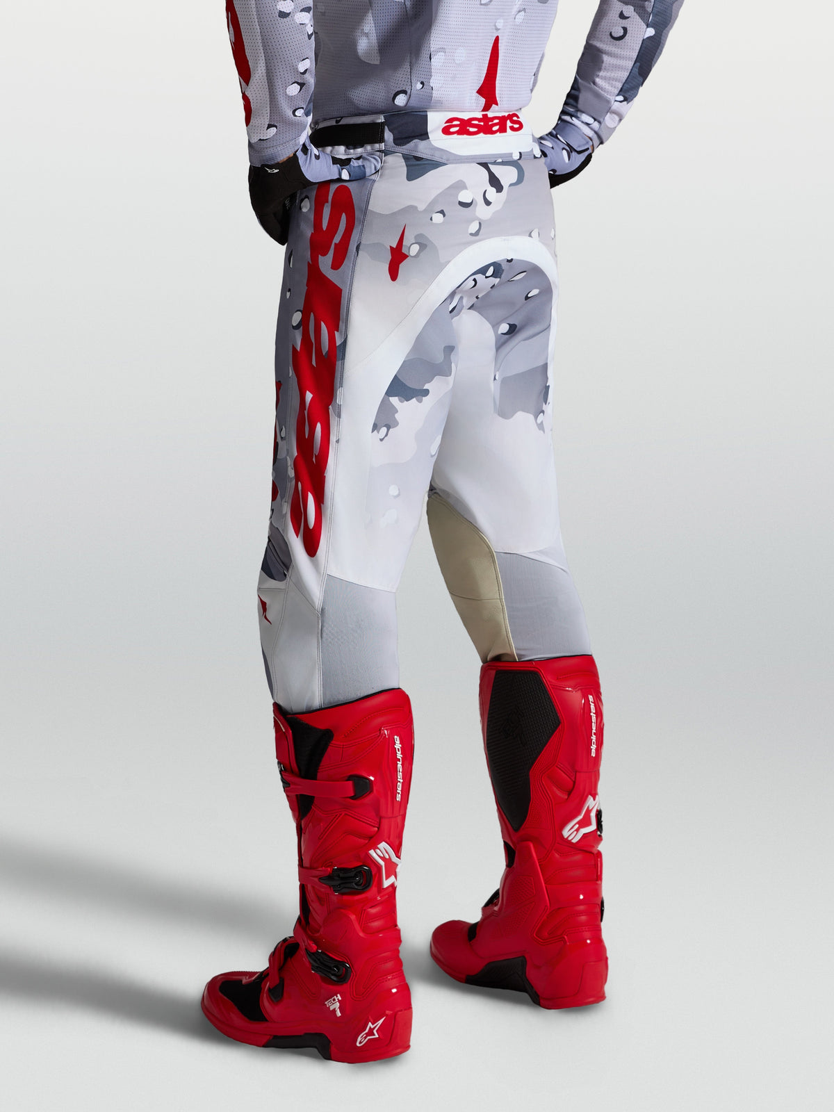 Alpinestars Racer Air Lone Pants in Gray Camo and White with Red accents, designed for motocross performance.