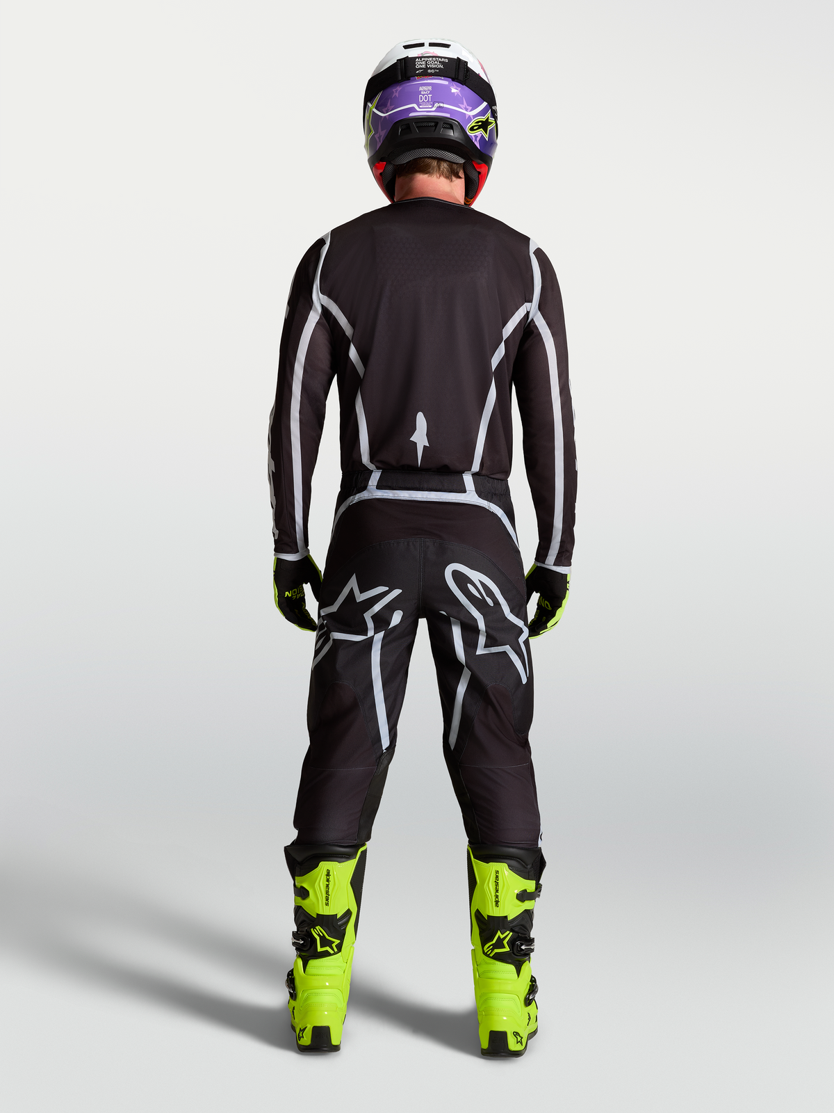 Alpinestars Fluid Apex V2 byxor, svarta och silver motocrossbyxor för herr, vy bakifrån med ergonomisk sportpassform