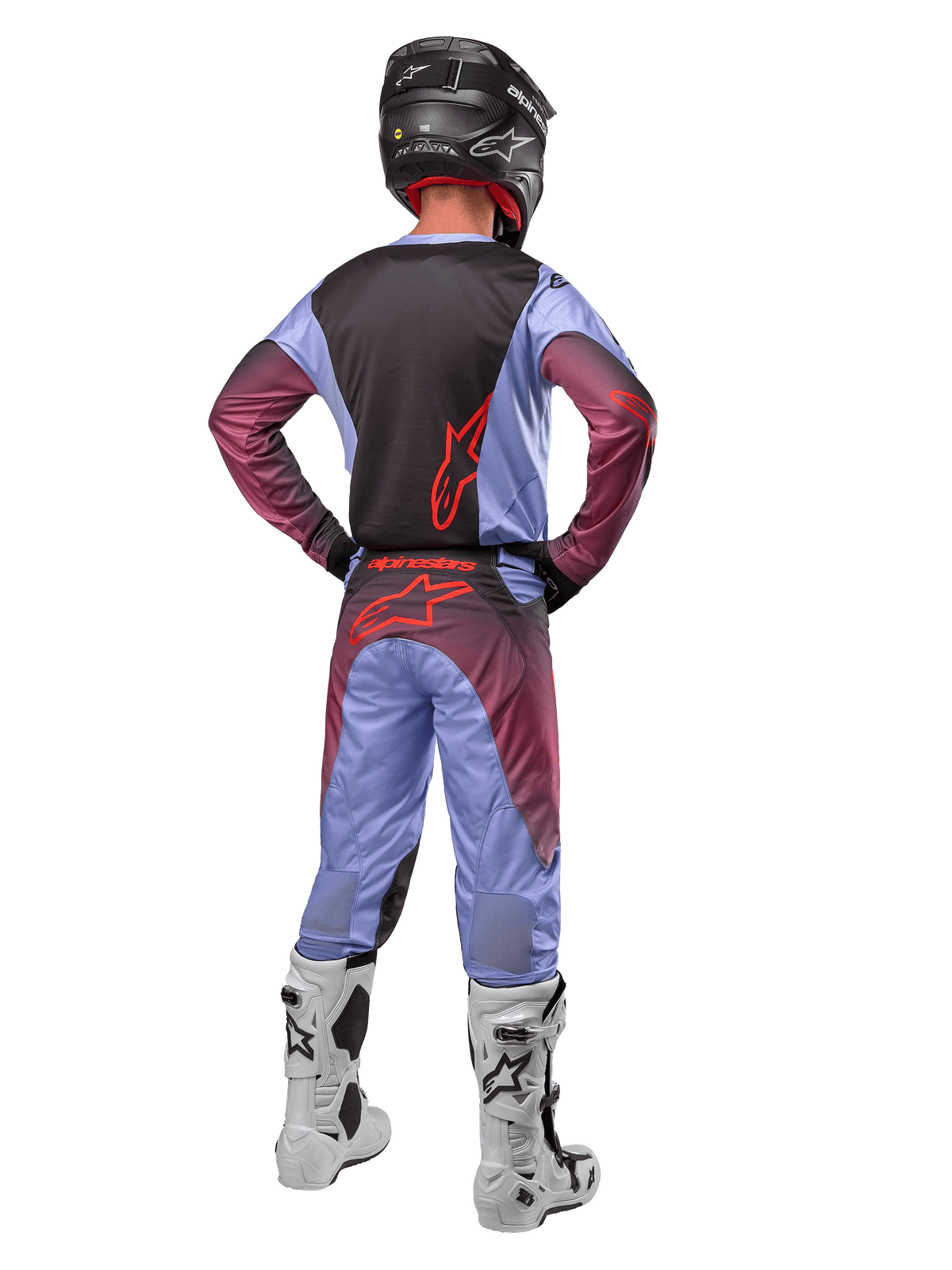 Alpinestars 2024 Racer Hoen tröja och byxor, Lavan Purple Black, helbild bakifrån av en motocrossförare i matchande utrustning med vita och svarta stövlar och en svart hjälm.