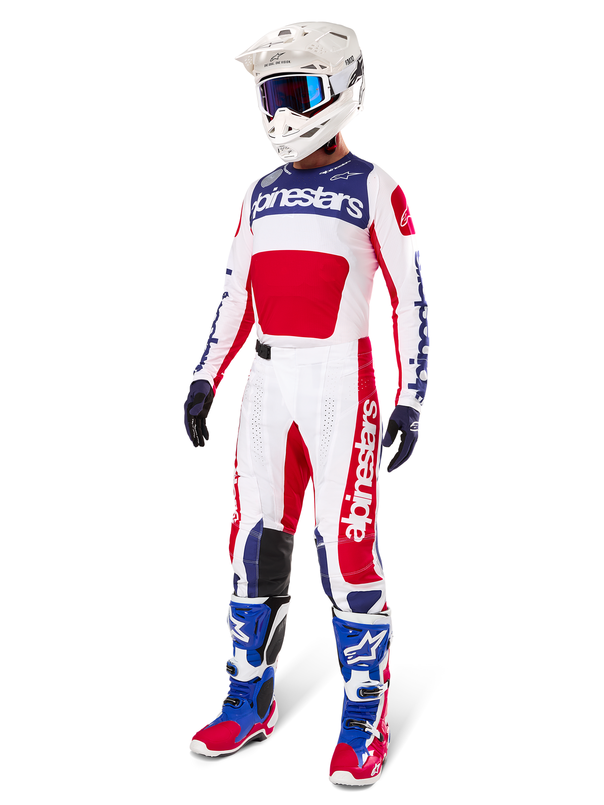 Alpinestars Limited Edition Techstar Fortitude-byxor, motocross-ställ, röd, vit och blå, bärs med matchande tröja, vit hjälm, blå goggles och blå och röda stövlar, koordinerad professionell racingoutfit för terrängkörning