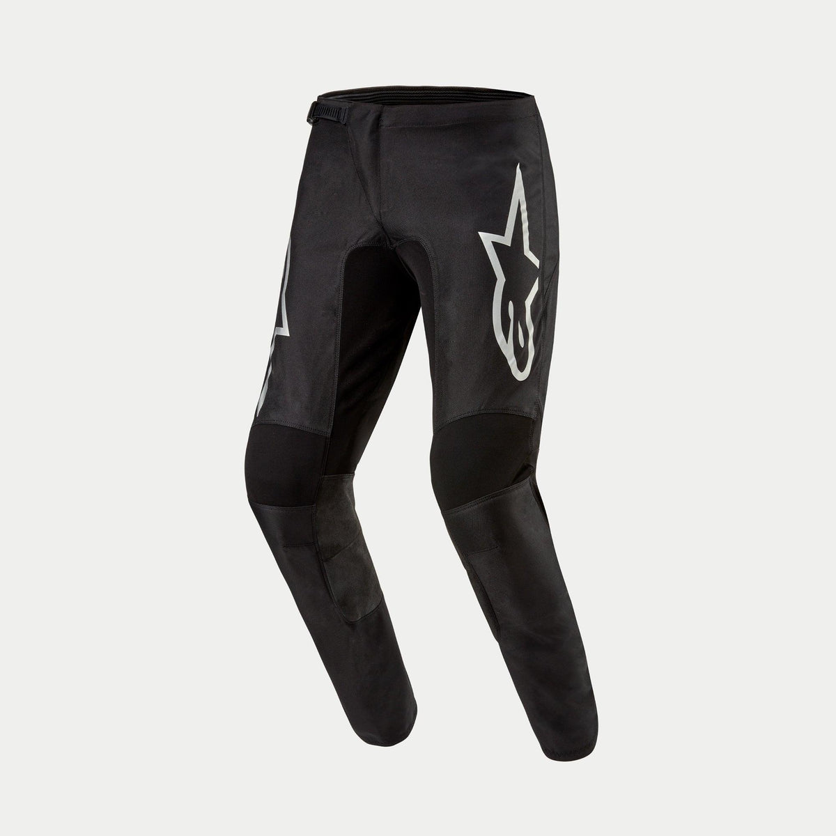Alpinestars 2024 Fluid Graphite Pants, Motocross Pants, Black and Silver, featuring a large silver Astar logo on the thigh, black reinforced knee panels, and an ergonomic pre-curved design for off-road racing