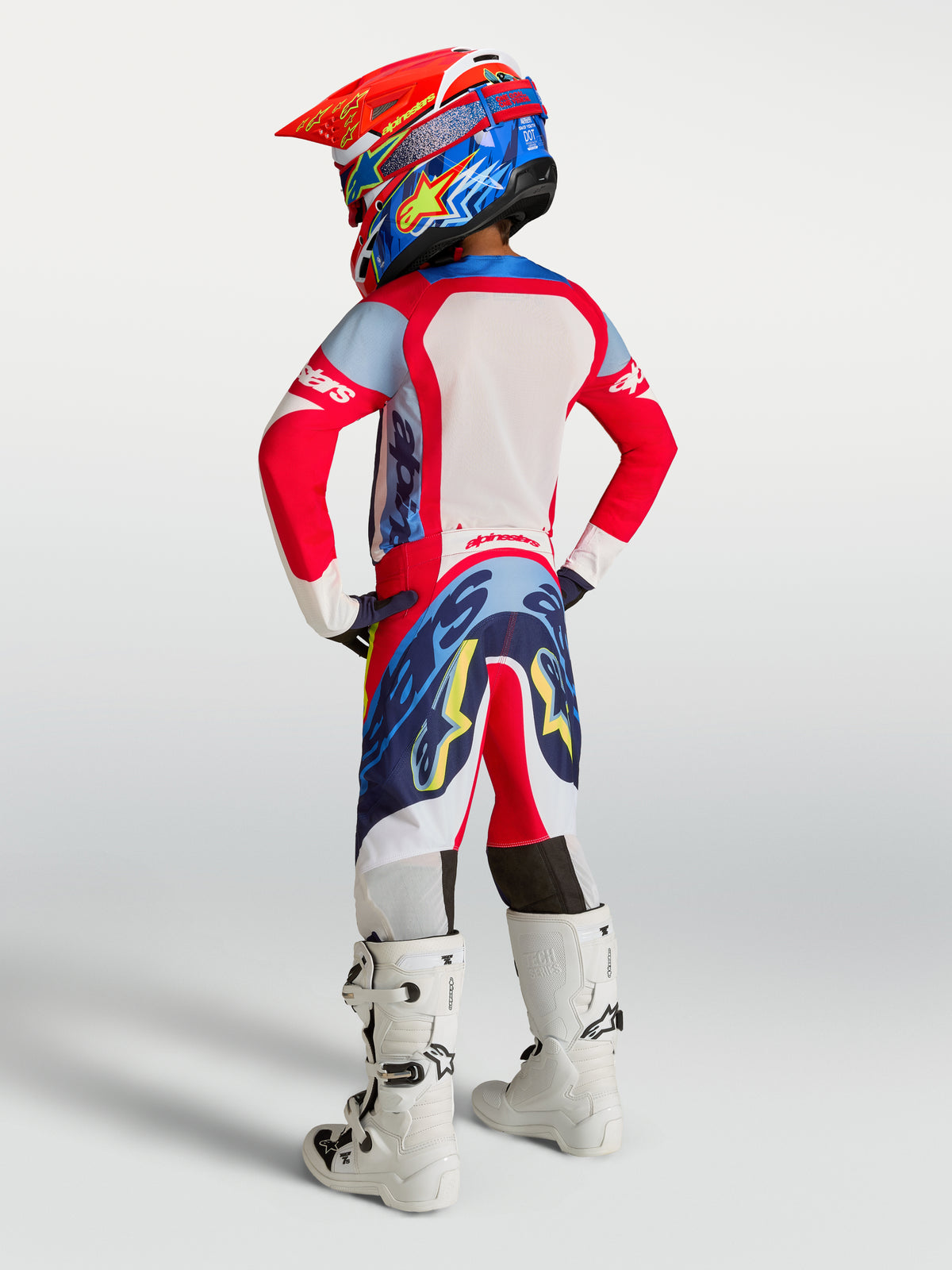 Alpinestars Supertech Dyna ungdomsbyxor 2027, röd och marinblå motocrossutrustning för barn med atletisk passform.