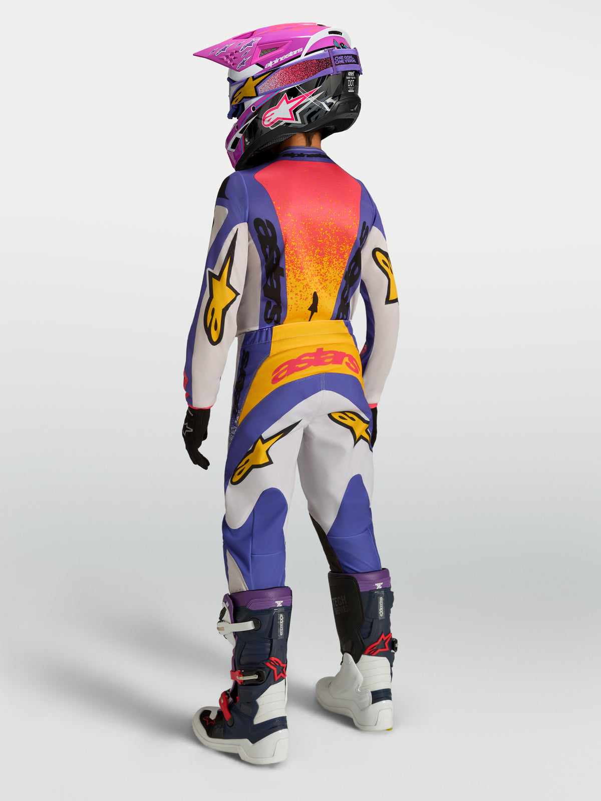 Alpinestars 2027 Ungdom Fluid Drag byxor, blå och guld motocrossbyxor, vy bakifrån med ergonomisk passform.