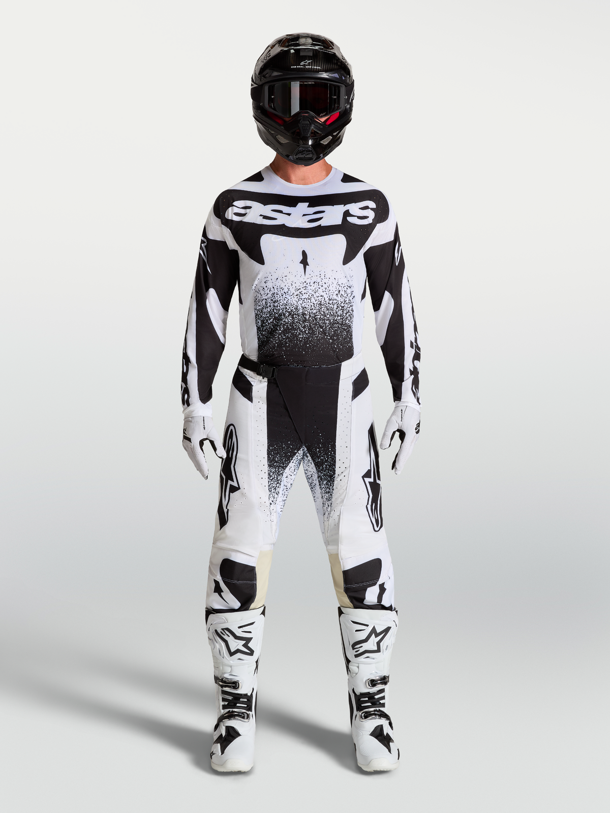 Alpinestars Techstar Swan tröja och Techstar Swan Gear Set, motocrossutrustning för herr, svart och vit med stänkgrafik.