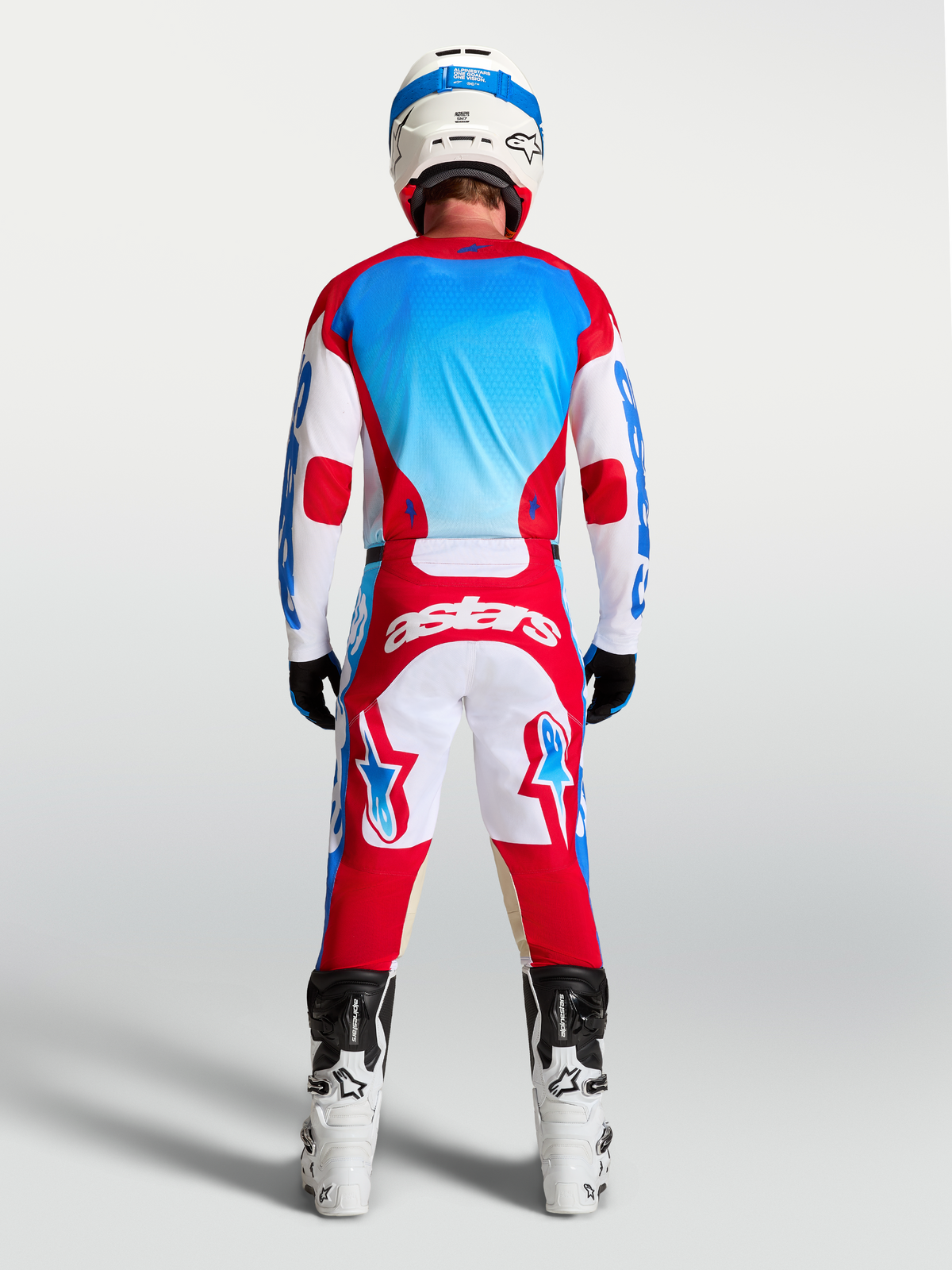 Alpinestars Racer Hunt tröja för herr, röd, vit och blå motocrosströja i fukttransporterande polytyg, vy bakifrån.
