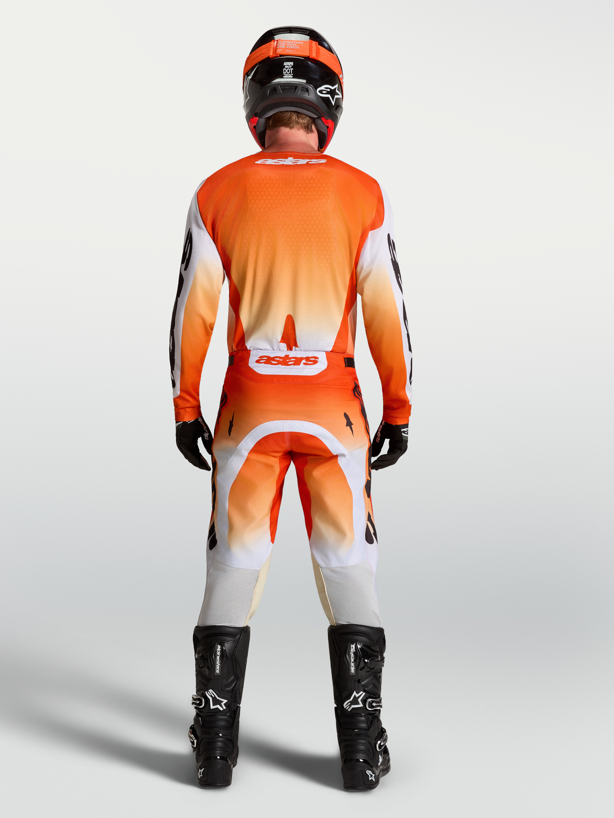 Alpinestars Racer Amber byxor och Racer Amber gear set, motocrossutrustning för herrar, orange och vit, vy bakifrån.