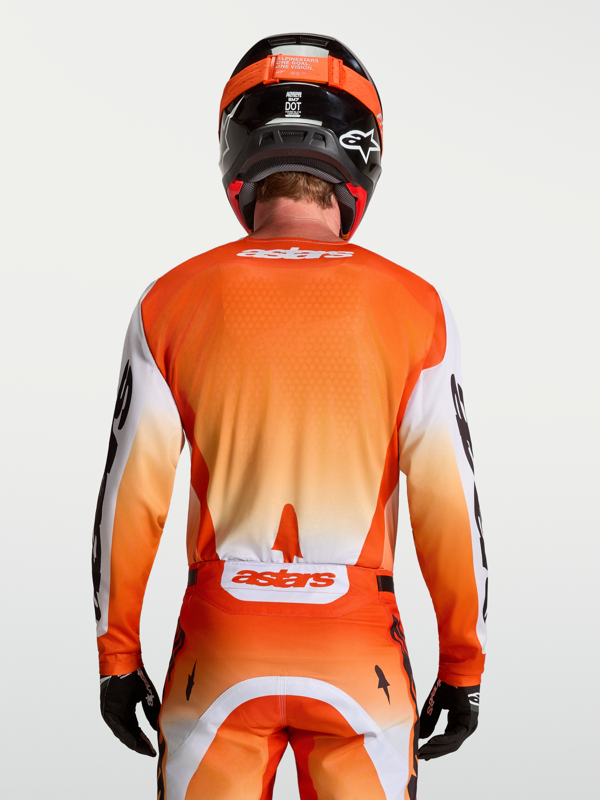 Alpinestars Racer Amber tröja, motocrosströja för herr, vy bakifrån, orange och vit, fukttransporterande material.