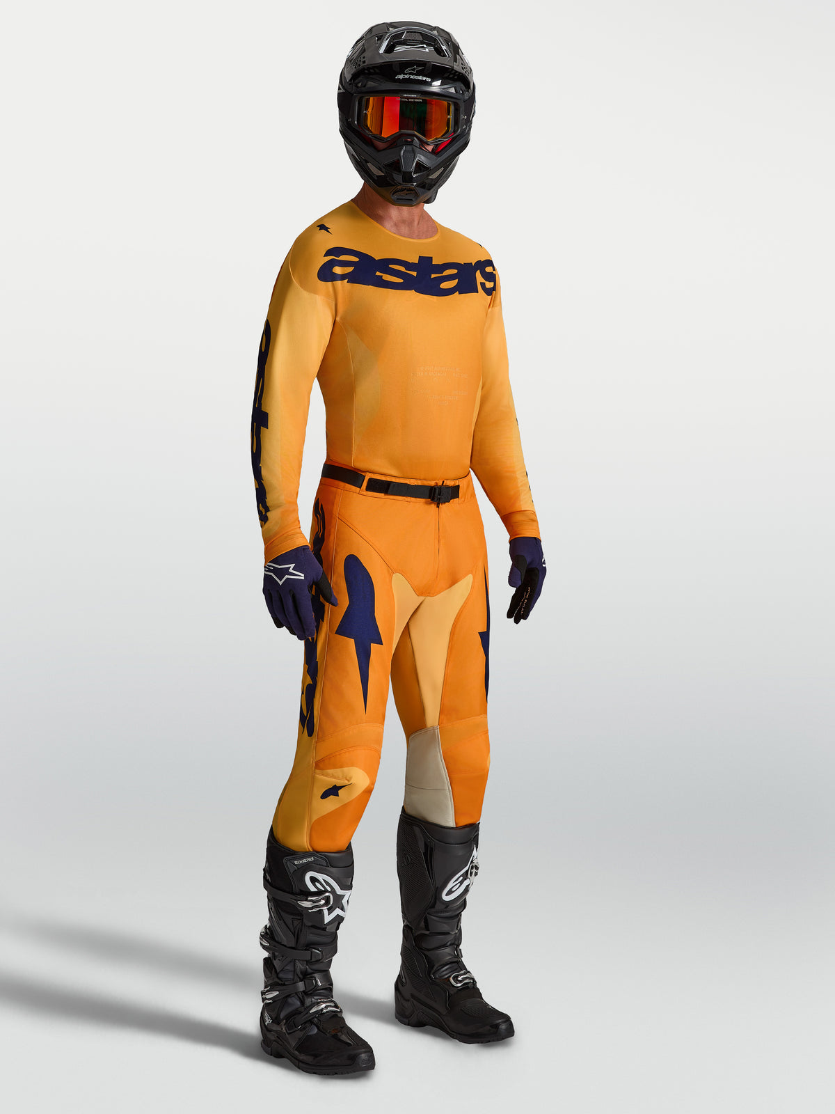 Alpinestars 2027 Racer Amber utrustningsset för herr, orange och mörkblå motocrosströja och byxor för terrängkörning.