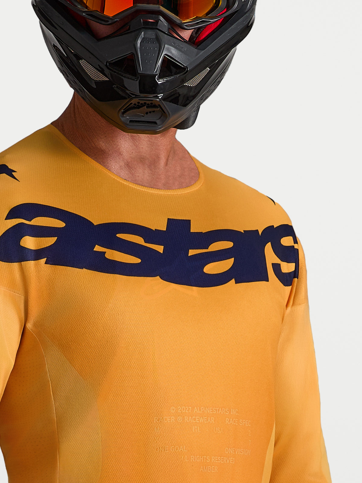Alpinestars Racer Amber tröja, orange och mörkblå motocrosströja med fukttransporterande material och logotyp på bröstet.