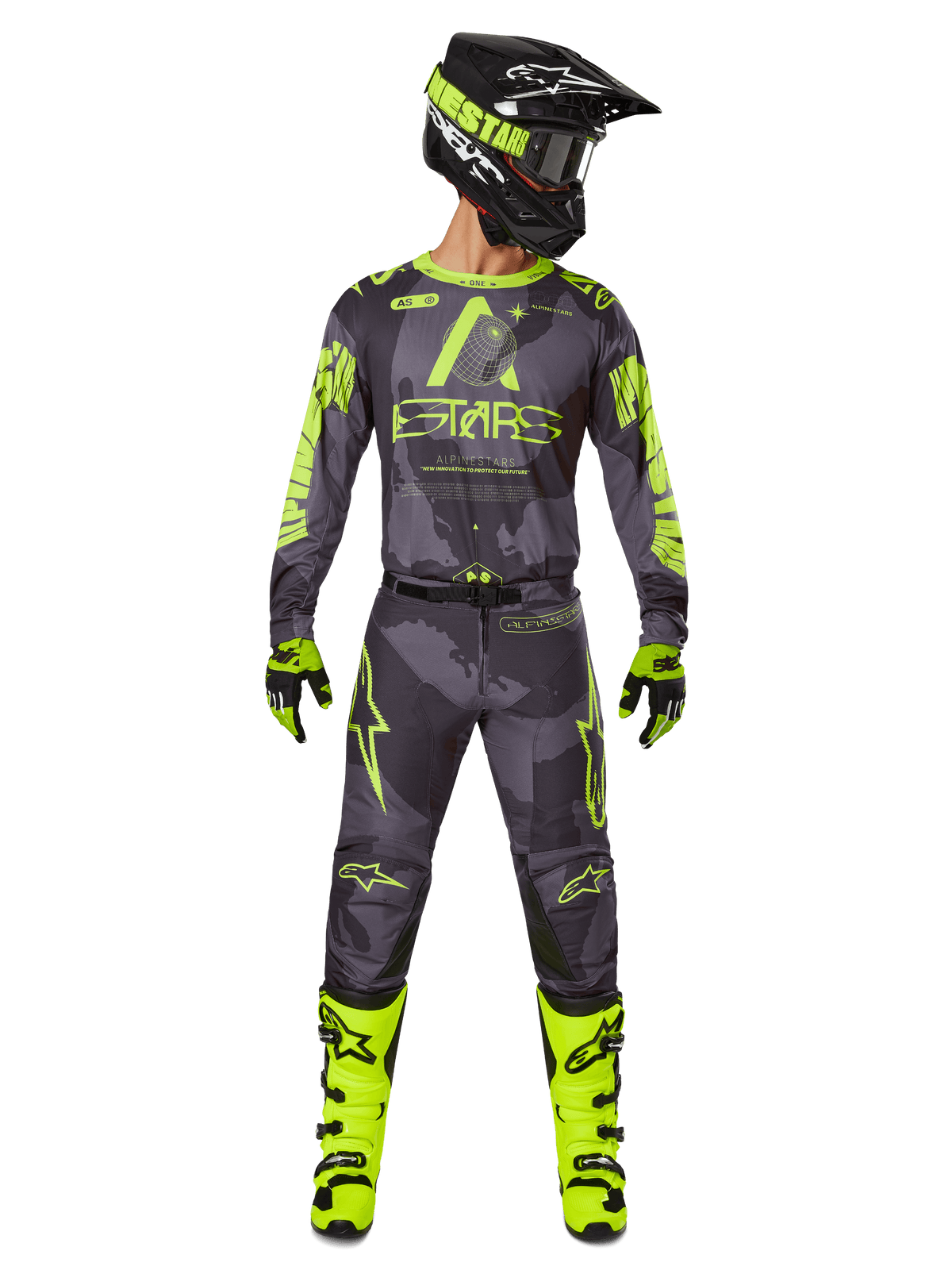 Motocross rider wearing complete racing gear, Alpinestars 2025 Racer Hollow Jersey and matching pants in Dark Camo Yellow Fluo, featuring bold fluorescent yellow graphics on a dark grey camouflage background, paired with matching gloves, bright yellow fluo boots, and a black helmet.