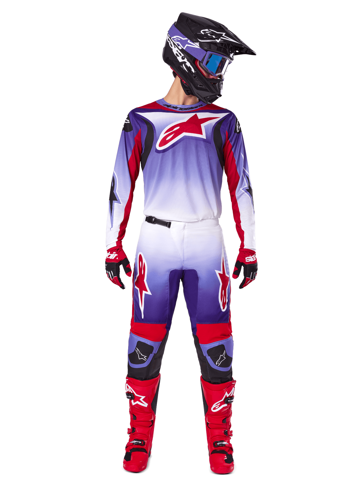 Motocross rider wearing complete Alpinestars racing gear, 2025 Fluid Wurx Jersey in Purple Bright Red with white accents and large red star logo, matching pants, red boots, and black helmet with goggles, coordinated outfit for off-road racing