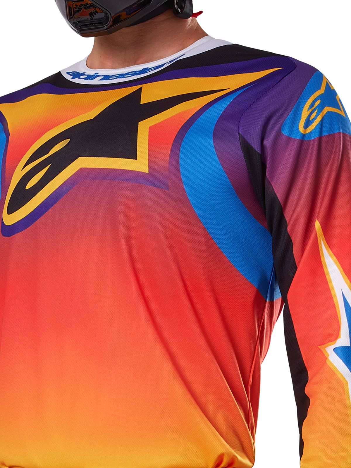 Alpinestars 2025 Fluid Wurx-tröja, mångfärgad design i vitt och orange, långärmad motocrosströja, avslappnad atletisk passform, fukttransporterande polytyg för terrängprestanda