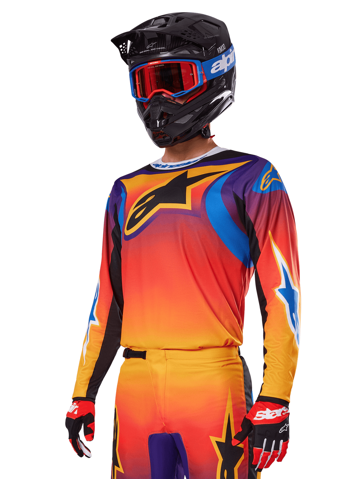 Alpinestars 2025 Fluid Wurx utrustningsset, motocross-set, orange, lila och blå gradient, med en stor svart A-stars-logotyp, bärs med en svart hjälm och blå goggles, koordinerad outfit för professionell offroad-racing