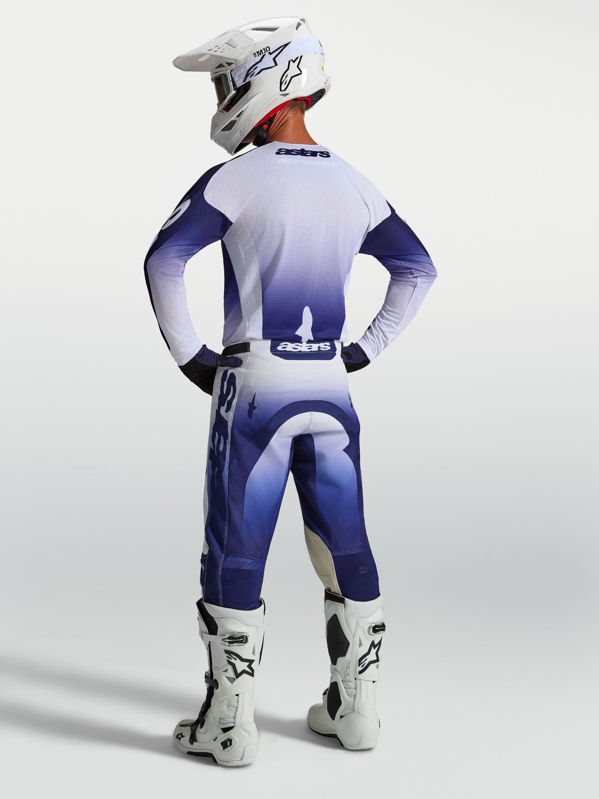 Alpinestars Racer Air Amber Jersey and Gear Set, navy blue and white mesh motocross gear, rear view on model in racing gear.