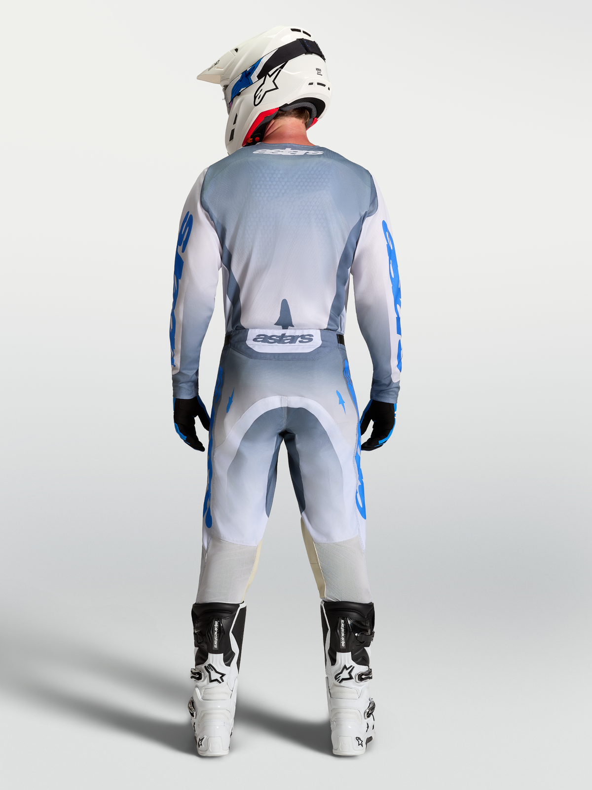 Alpinestars Racer Amber Pants, Men's Motocross Gear in Ash Gray and UCLA Blue, shown from the back in a full outfit.