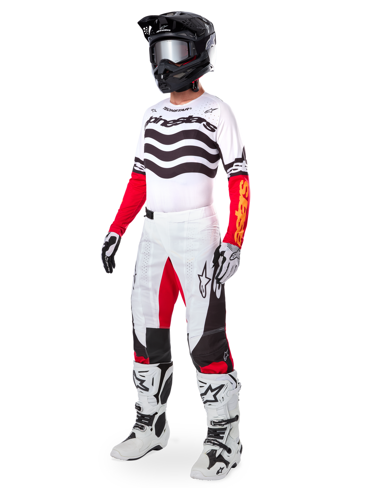 Alpinestars Limited Edition Techstar Deep-utrustningsset, komplett motocrossutrustning, vit tröja med svarta vågmönster och röda ärmar, vita byxor med röda och svarta detaljer, svart hjälm med silverfärgade goggles, vita och svarta handskar, vita stövlar, matchande MX-racingoutfit