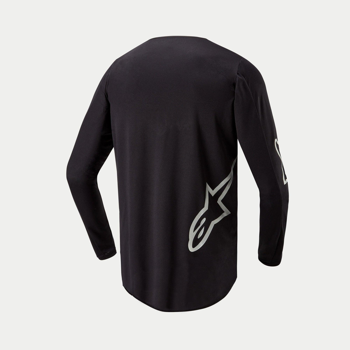 Alpinestars 2024 Fluid Graphite-tröja, motocrosströja, svart och silver, baksida med en silverfärgad stjärnlogotyp på den nedre delen, långärmad design med förlängt ryggparti för täckning vid terrängkörning.