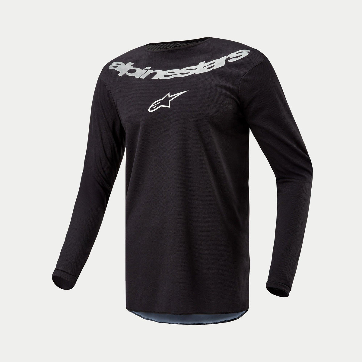 Alpinestars 2024 Fluid Graphite tröja, motocrosströja, svart och silver, långärmad funktionstopp med stor silverfärgad Alpinestars-logotyp och stjärnsymbol på bröstet, lätt fuktavledande material för terrängkörning