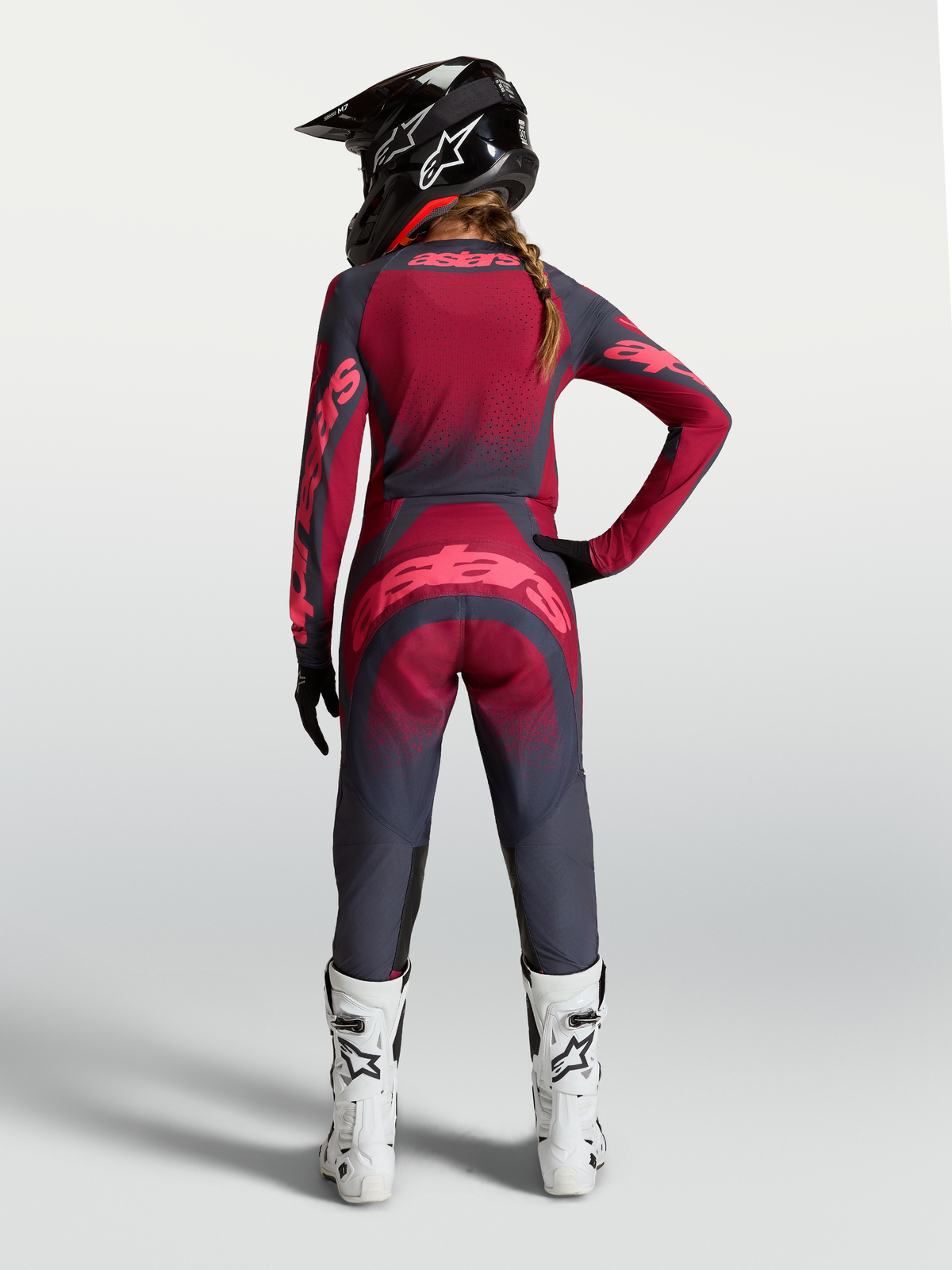 Alpinestars Stella Techstar Swan Jersey, women's crimson and dark gray motocross gear with ventilation, rear on-model view.
