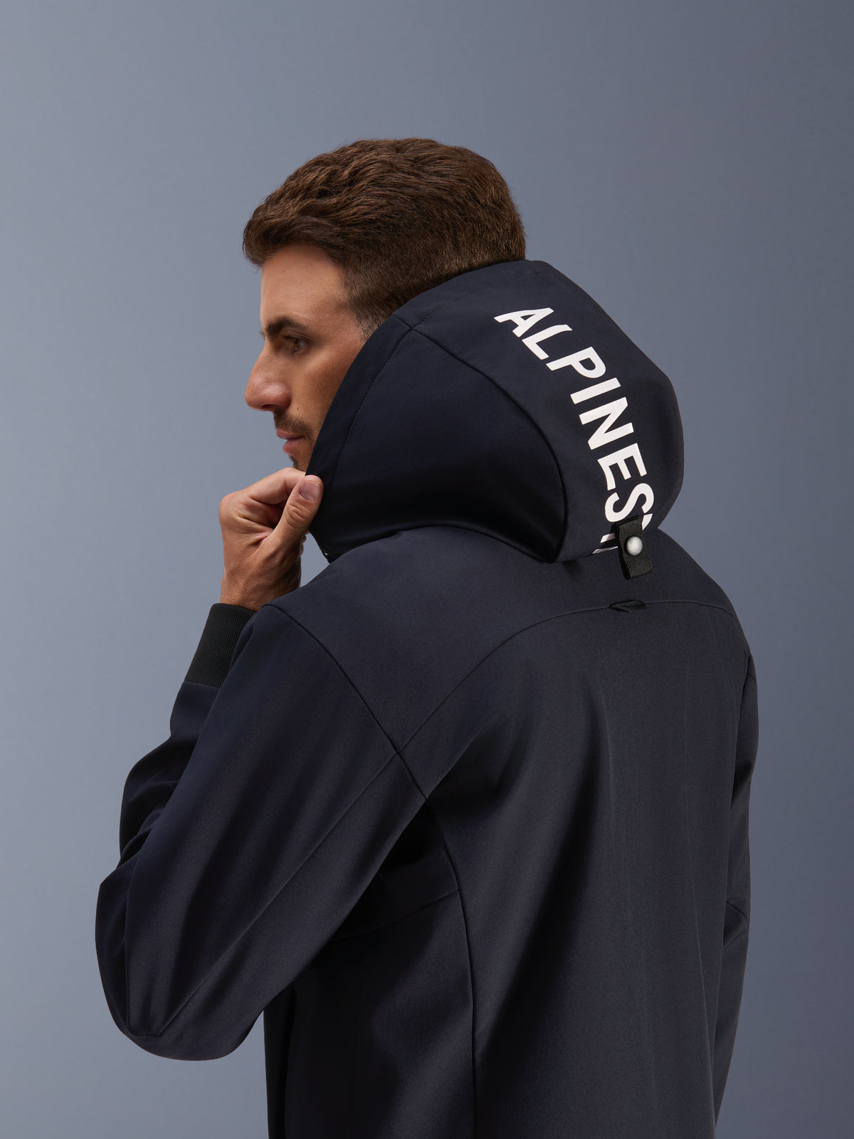 Alpinestars Radium Tech Hoodie, black urban motorcycle jacket for men with white hood logo and windproof 3L shell.