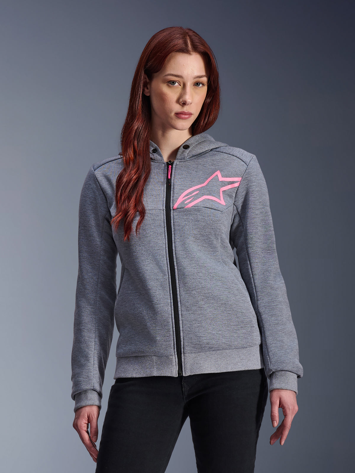 Alpinestars Stella Chrome V2 Sport Hoodie, Women's Motorcycle Hoodie, Gray Heather with Pink Fluo star logo, tech fleece fabric with ribbed cuffs and hem, black front zipper with pink pull, casual urban riding streetwear worn with black pants