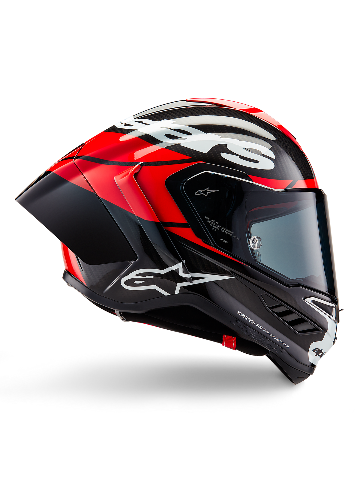 Alpinestars Supertech R10 Element hjälm, heltäckande racinghjälm för motorcykel, svart kolfiber med ljusröda och vita detaljer, sidoprofil som visar aerodynamiskt kolfiberskal, blank finish med vit logotyp, tonat visir, professionellt racingskydd