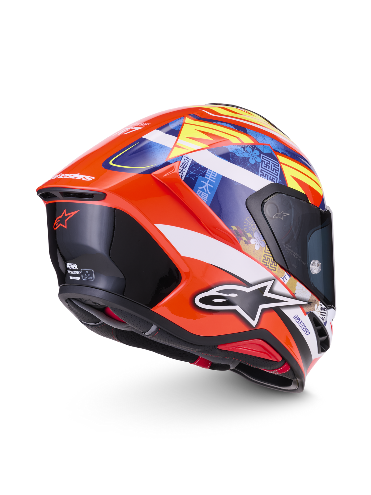 Alpinestars S-R7 Taiyo Furusato Helmet, Full Face Motorcycle Racing Helmet in Red and Multicolor, rear three-quarter view showing the aerodynamic spoiler, graphic print details, and carbon composite construction, ECE 22.06 certified.